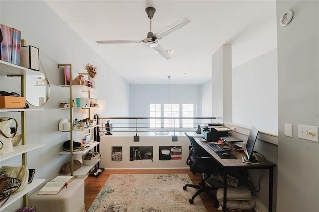 office area with wood finished floors and ceiling fan