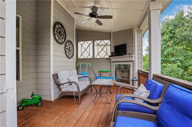 wooden terrace with a ceiling fan
