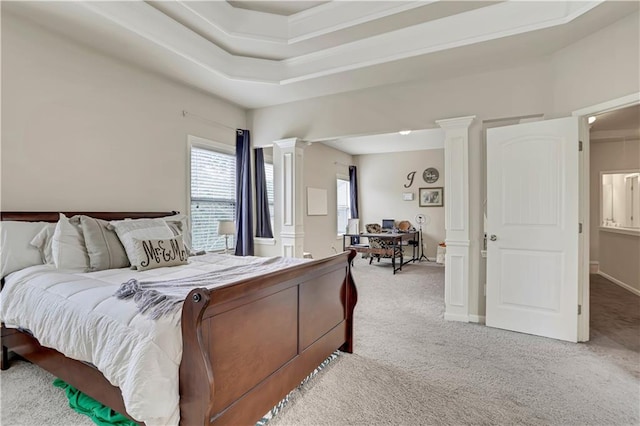 bedroom with ornate columns and carpet floors
