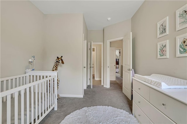 bedroom with baseboards and carpet floors