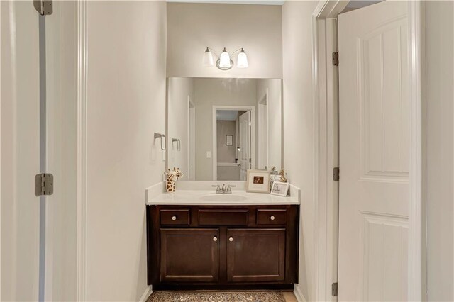 bathroom with vanity and baseboards