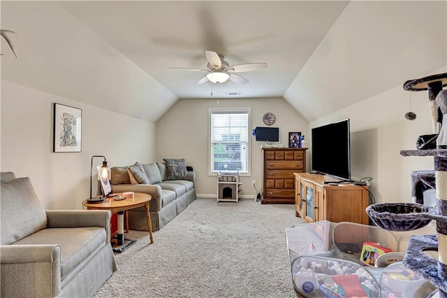 carpeted living area featuring visible vents, baseboards, a ceiling fan, and lofted ceiling