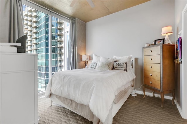 855 Peachtree St NE Unit 1703, Atlanta, GA 30308 - bedroom with carpet flooring, multiple windows, access to exterior, ceiling fan, and expansive windows