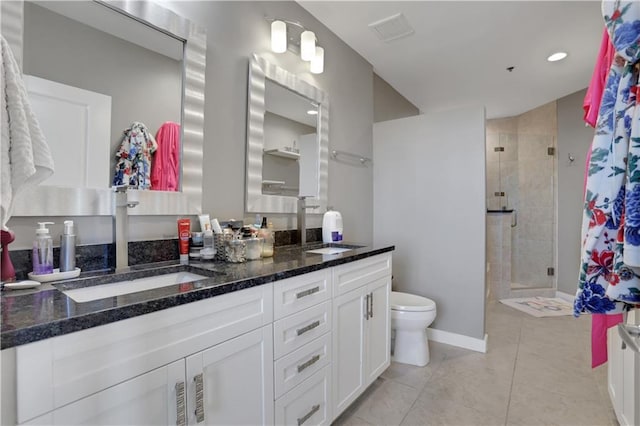 855 Peachtree St NE Unit 1703, Atlanta, GA 30308 - full bath with a shower stall, double vanity, toilet, tile patterned flooring, and baseboards