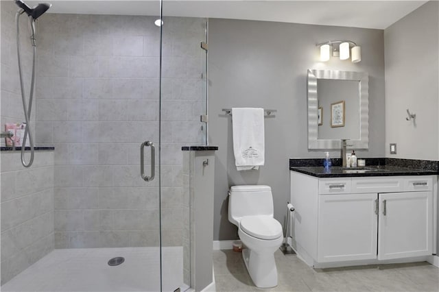 855 Peachtree St NE Unit 1703, Atlanta, GA 30308 - full bathroom with vanity, a shower stall, toilet, tile patterned floors, and baseboards