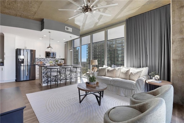 855 Peachtree St NE Unit 1703, Atlanta, GA 30308 - living area featuring dark wood-style floors and ceiling fan