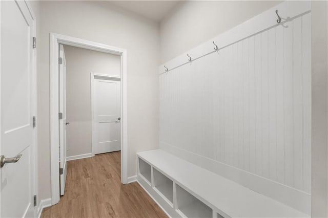 mudroom with light hardwood / wood-style floors