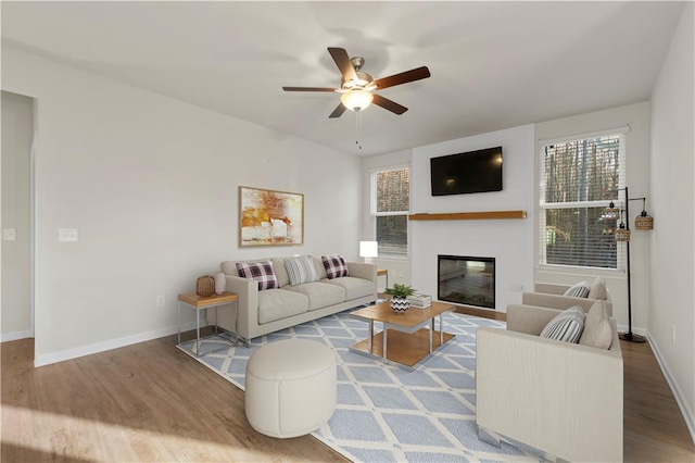 living room with ceiling fan and hardwood / wood-style floors