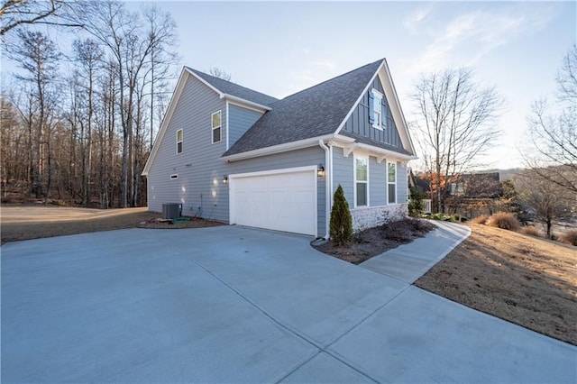 view of home's exterior featuring a garage and central air condition unit