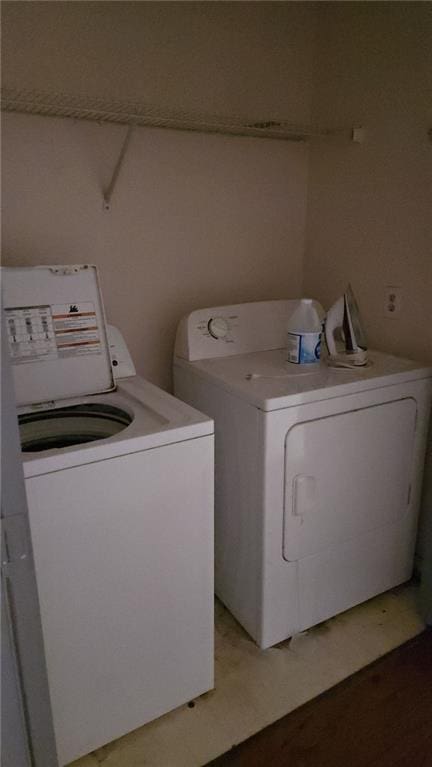 laundry area featuring laundry area and washing machine and dryer