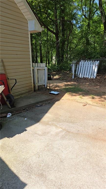 view of yard featuring a patio and fence