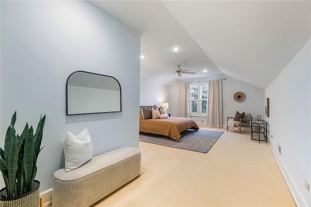 carpeted bedroom featuring ceiling fan and vaulted ceiling