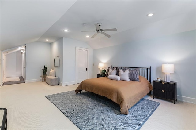 carpeted bedroom featuring ceiling fan and vaulted ceiling