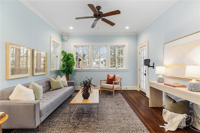 living room featuring dark wood-type flooring, ceiling fan, and ornamental molding