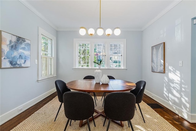 dining room featuring dark hardwood / wood-style flooring and crown molding