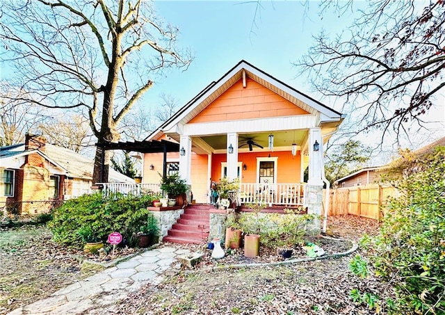 bungalow-style house featuring ceiling fan and covered porch