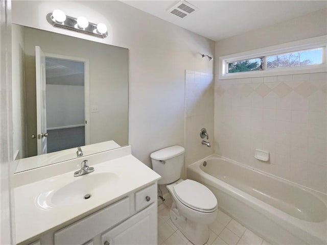 bathroom featuring visible vents, toilet, tile patterned floors, vanity, and washtub / shower combination