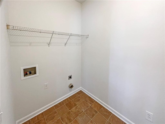 clothes washing area featuring baseboards, laundry area, hookup for a washing machine, and hookup for an electric dryer