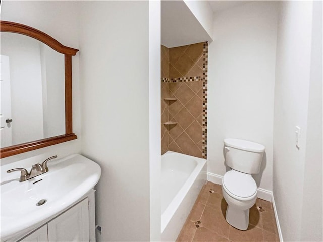 bathroom with toilet, washtub / shower combination, vanity, baseboards, and tile patterned floors