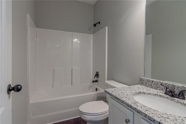 full bath featuring vanity, toilet, and washtub / shower combination