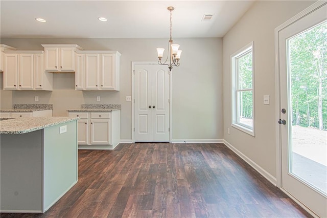 kitchen with a chandelier, baseboards, white cabinets, and dark wood-style flooring