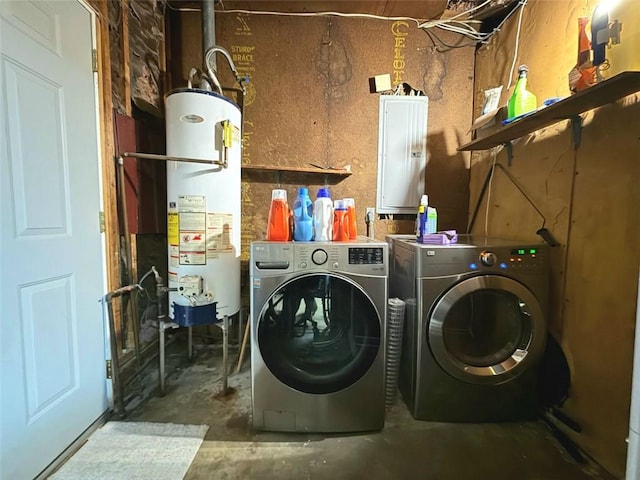 laundry room with water heater, laundry area, washer and dryer, and electric panel