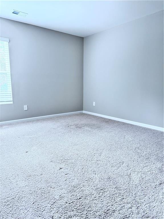 spare room featuring carpet floors