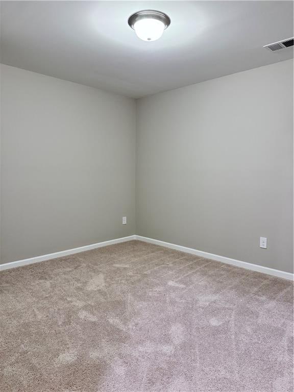 unfurnished room featuring carpet flooring