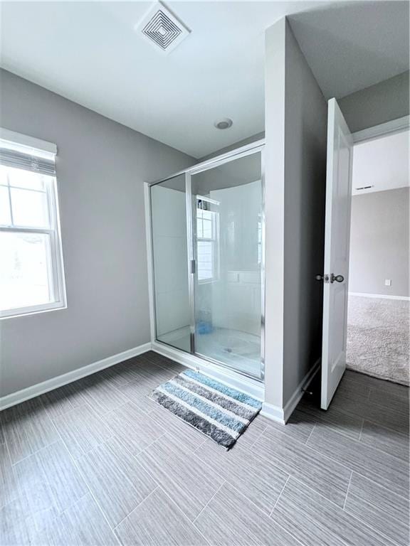 bathroom featuring an enclosed shower