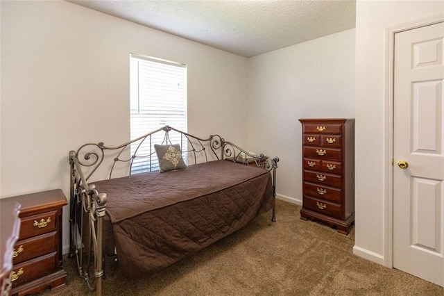 bedroom with baseboards and carpet flooring