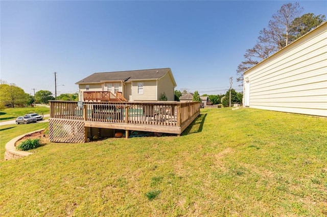 view of front of house with an attached garage, a front lawn, and concrete driveway