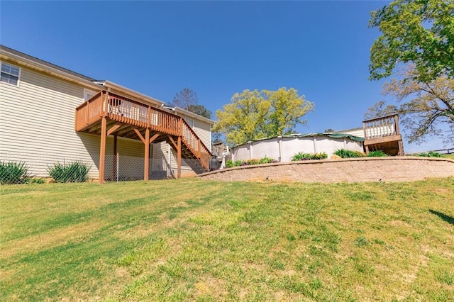 view of yard with stairway and a wooden deck