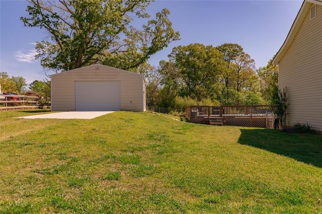 split foyer home with a garage, an outbuilding, and a front yard