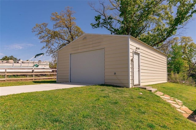view of yard featuring an outdoor structure, fence, a wooden deck, and a detached garage