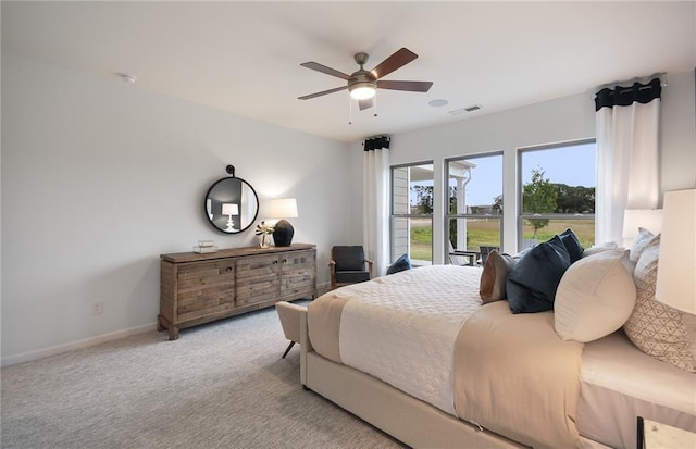 bedroom with light colored carpet and ceiling fan