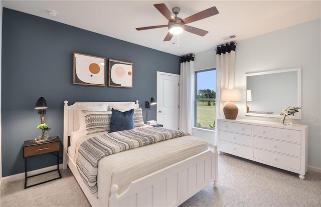 bedroom with light carpet and ceiling fan