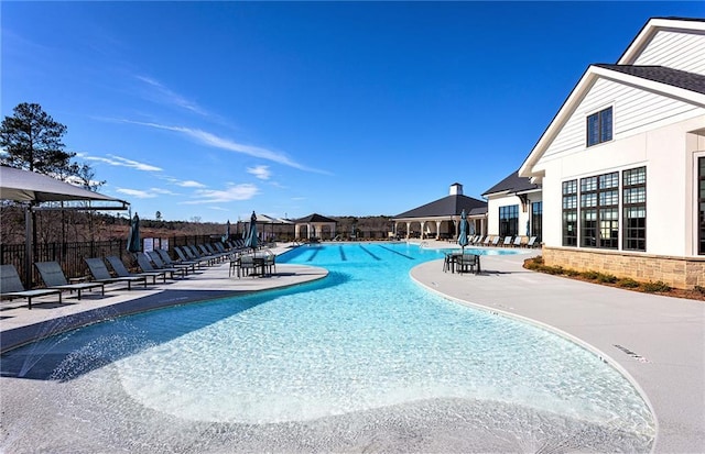 view of swimming pool with a patio area