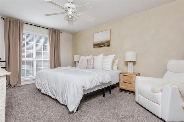 bedroom with light carpet and ceiling fan