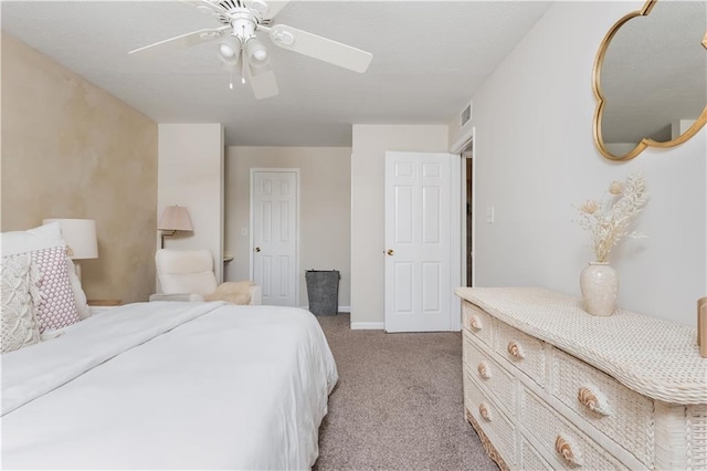 bedroom featuring light carpet, ceiling fan, visible vents, and baseboards