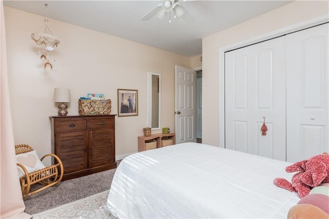 bedroom featuring ceiling fan, a closet, and carpet