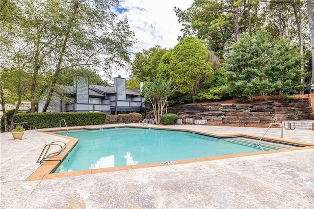 pool featuring a patio area