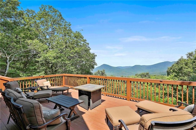 wooden deck featuring a mountain view