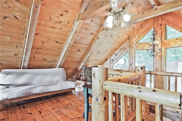 bedroom with wood ceiling, lofted ceiling with beams, hardwood / wood-style flooring, a notable chandelier, and wood walls