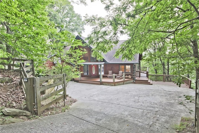 rear view of house with a wooden deck