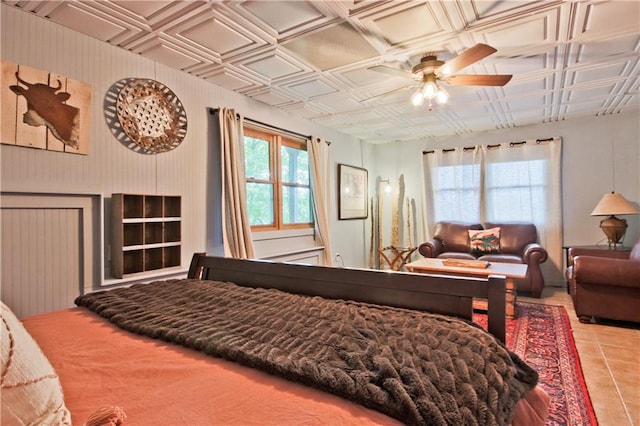 tiled bedroom with ceiling fan