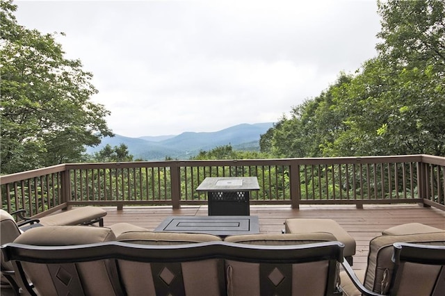 wooden deck featuring a mountain view