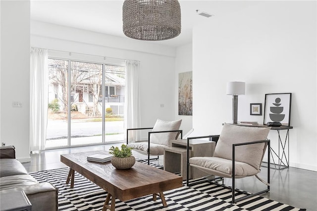 living room featuring visible vents and baseboards