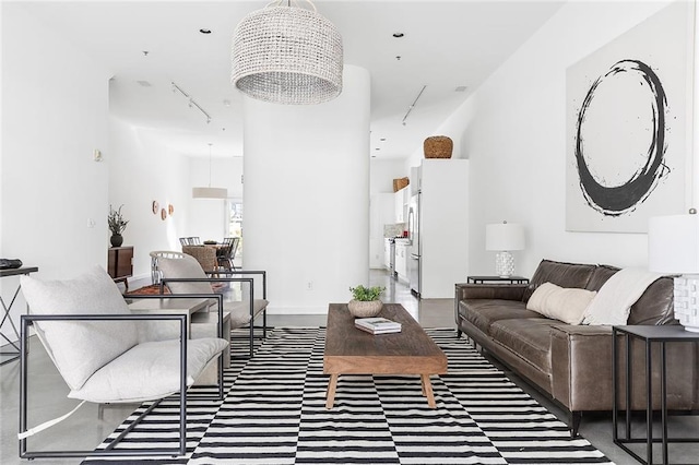 living room with a notable chandelier