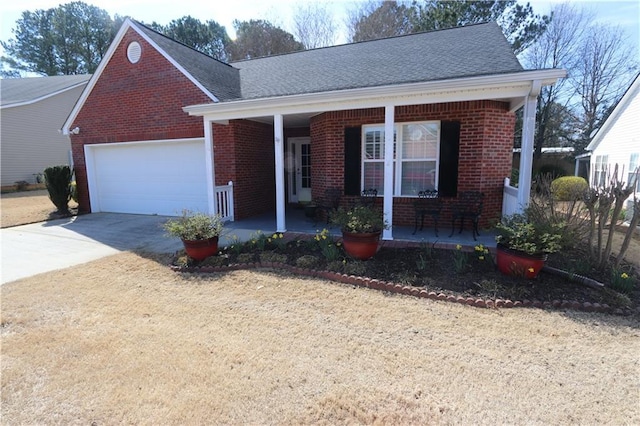 view of front of property featuring driveway, a garage, a porch, and brick siding