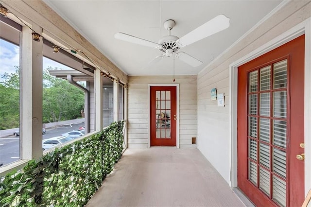 entrance to property with ceiling fan